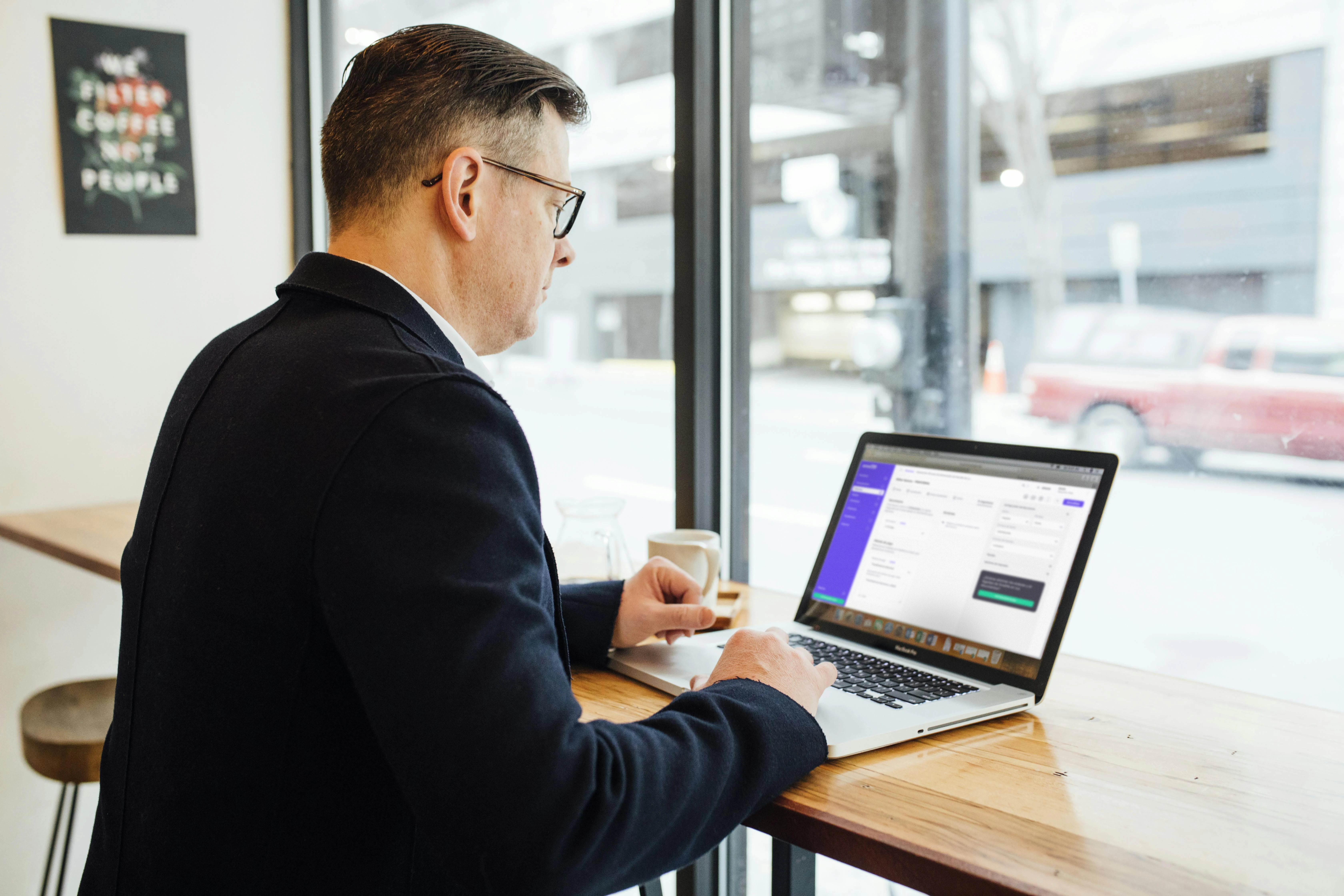 Control of invoices and clients in one place Professional working on their computer with invoicing software